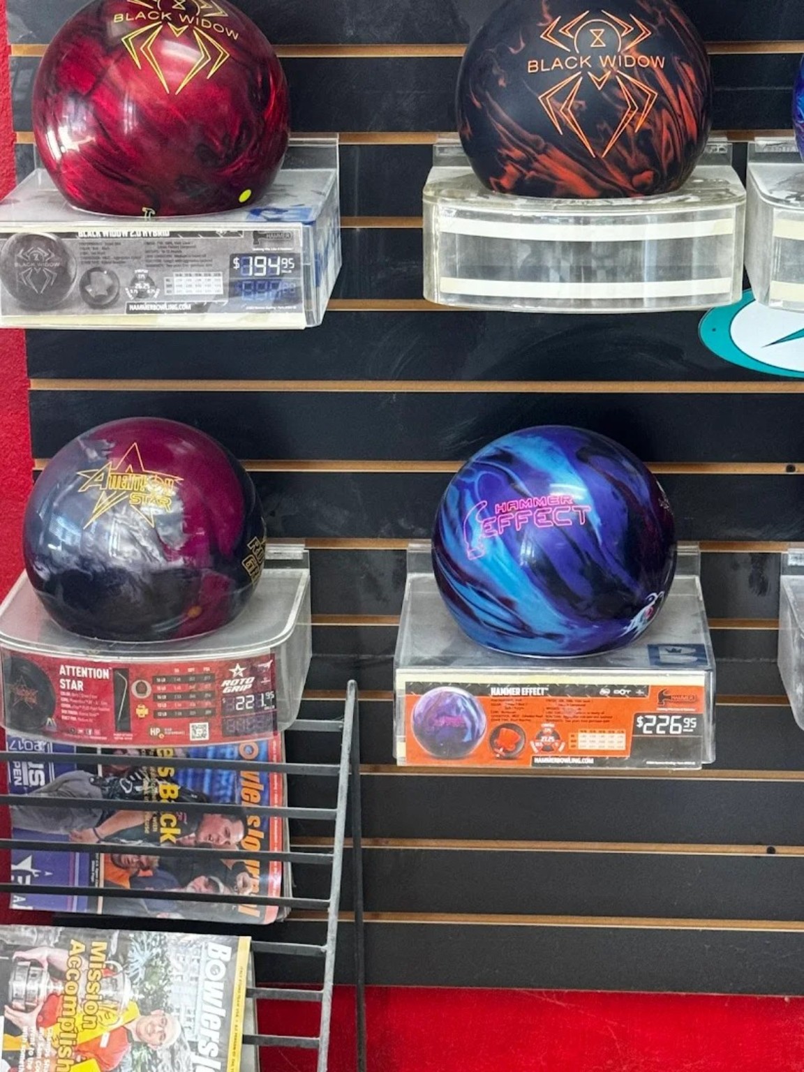 Bowling balls displayed for sale.